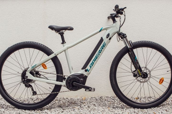 a bicycle parked on the side of a road