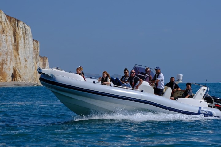 a group of people on a boat in the water