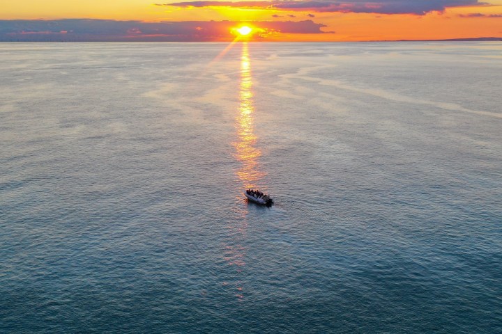 a sunset over a body of water